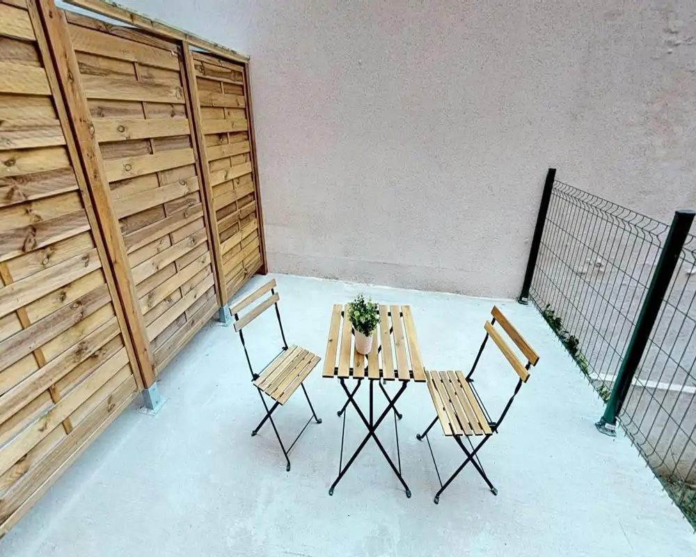 Unable to classify: the photo is heavily corrupted by green horizontal artifacts which obscure the scene and prevent reliable room identification.