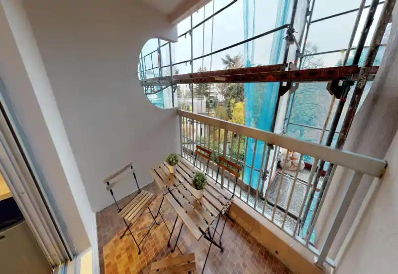 Unable to classify this image: heavy digital corruption and visual artifacts obscure the scene, preventing identification of room type or usable listing details.