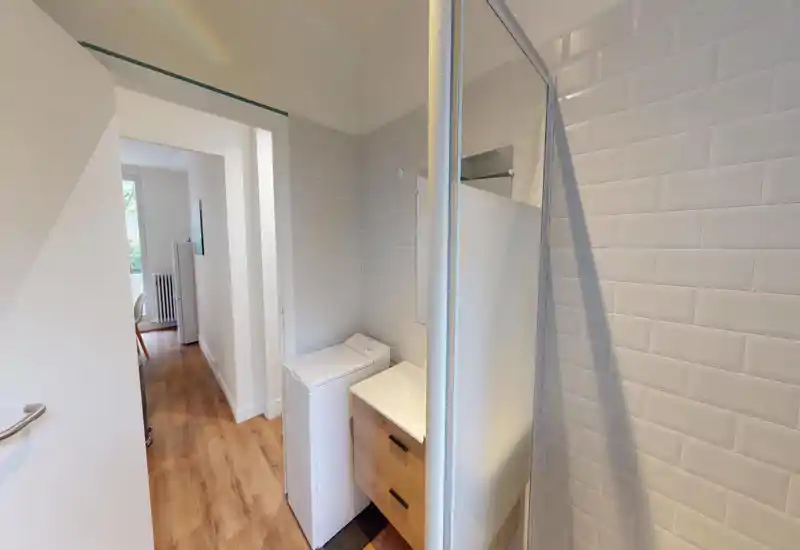 The image is too corrupted by heavy pixelation and visual artifacts to identify the room type reliably.