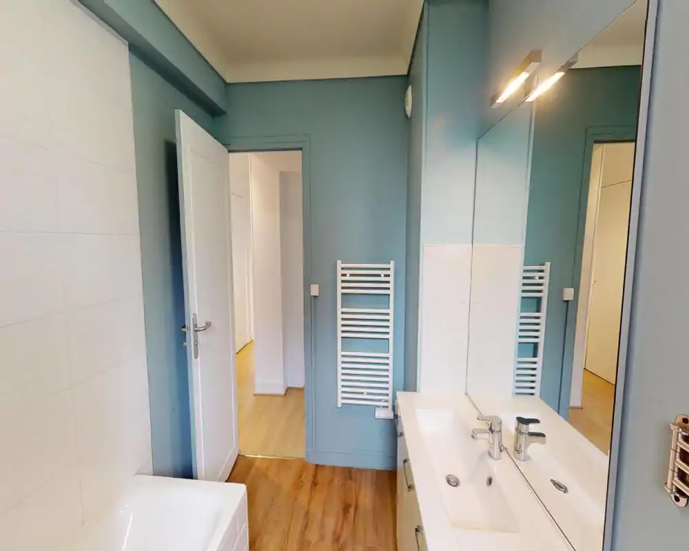 Unable to classify: the image is heavily corrupted by digital artifacts and large-scale pixelation, so room features (bed, sofa, appliances, or fixtures) are not reliably visible.