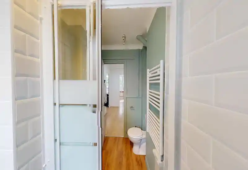 Image is too corrupted to determine the room type. The photo contains heavy digital distortion and artifacts that obscure furniture and architectural details.