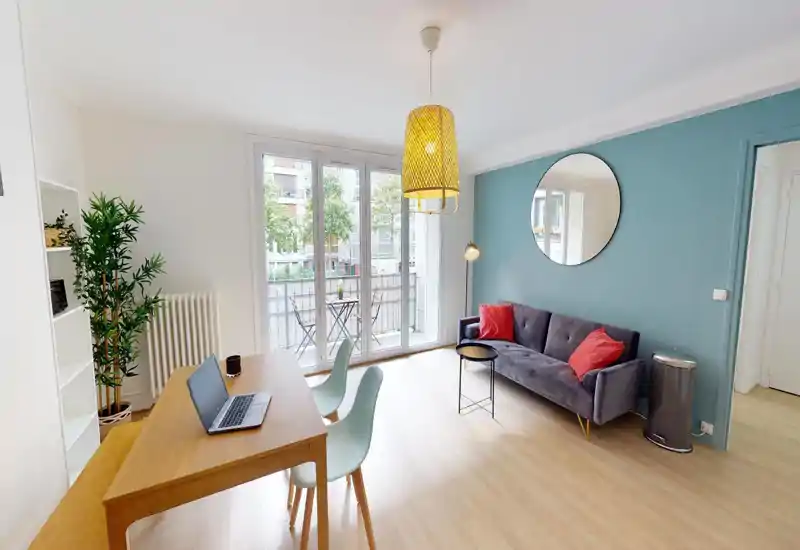 Bright living area with a comfy armchair, cushions and potted plants; modern, relaxed layout ideal for a rental listing.