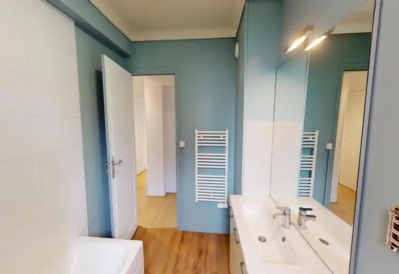 Unable to classify: the image is heavily corrupted by digital artifacts and large-scale pixelation, so room features (bed, sofa, appliances, or fixtures) are not reliably visible.