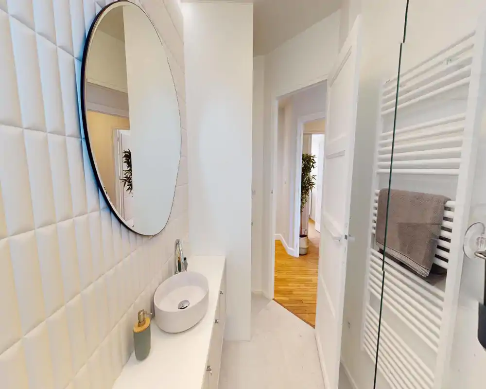 Unable to provide a reliable room description: the image is heavily corrupted and visual details are not discernible.