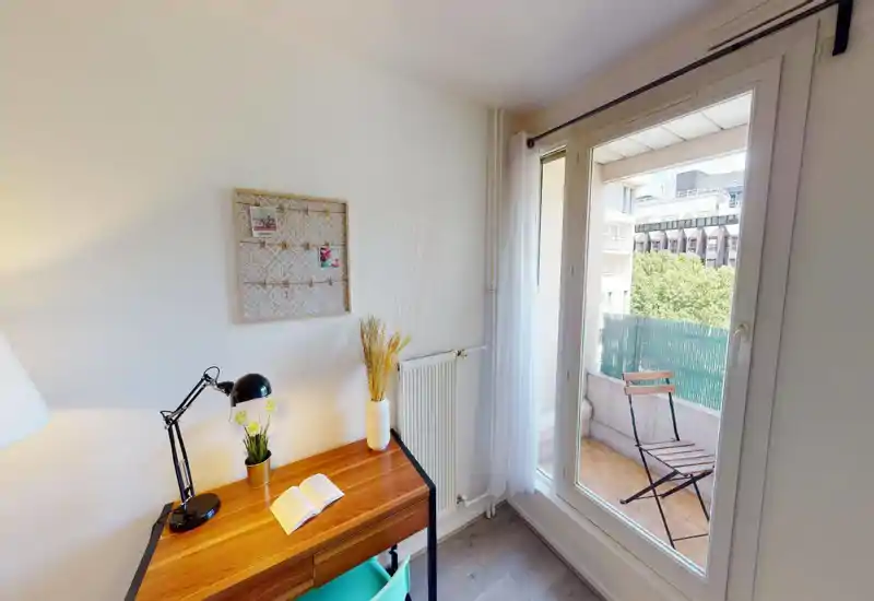 Appears to be a bedroom with a bed and slanted windows, but the image is severely corrupted and details are obscured.