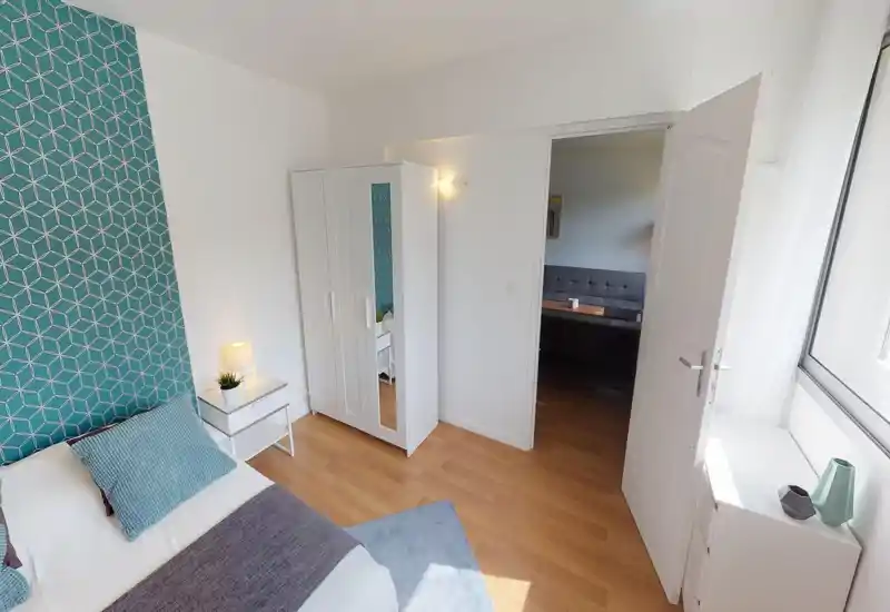 The image is too corrupted and pixelated to reliably identify the room or describe its features.