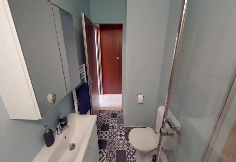 Unable to classify: the image is severely corrupted by digital artifacts and banding, which obscures the room's contents and prevents reliable identification.