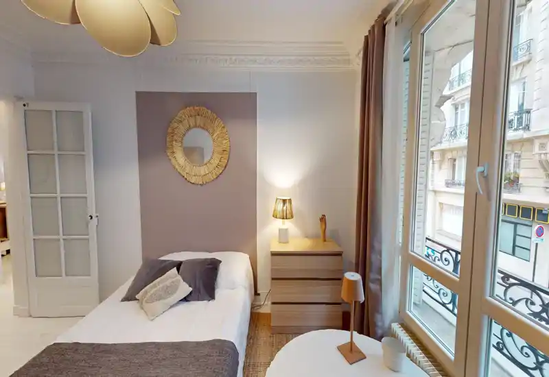 Sunny, well-styled bedroom with a comfortable single/double bed, bedside drawers and large window providing abundant natural light.