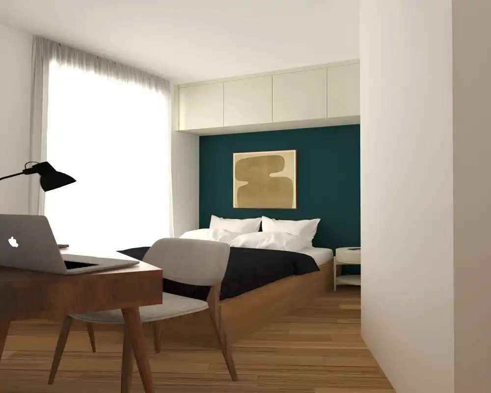 Chambre moderne et lumineuse avec lit intégré, mur d'accent bleu-vert et rangement mural. Grande fenêtre apportant une lumière douce; table de chevet et bureau pour un espace à la fois reposant et fonctionnel.