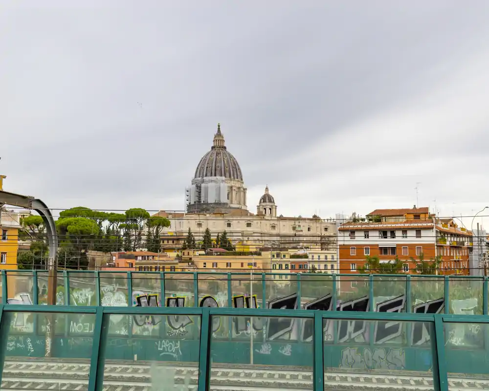 City skyline view from an elevated outdoor platform with a clear sightline to a large domed cathedral and surrounding buildings—ideal for listings highlighting location and views.